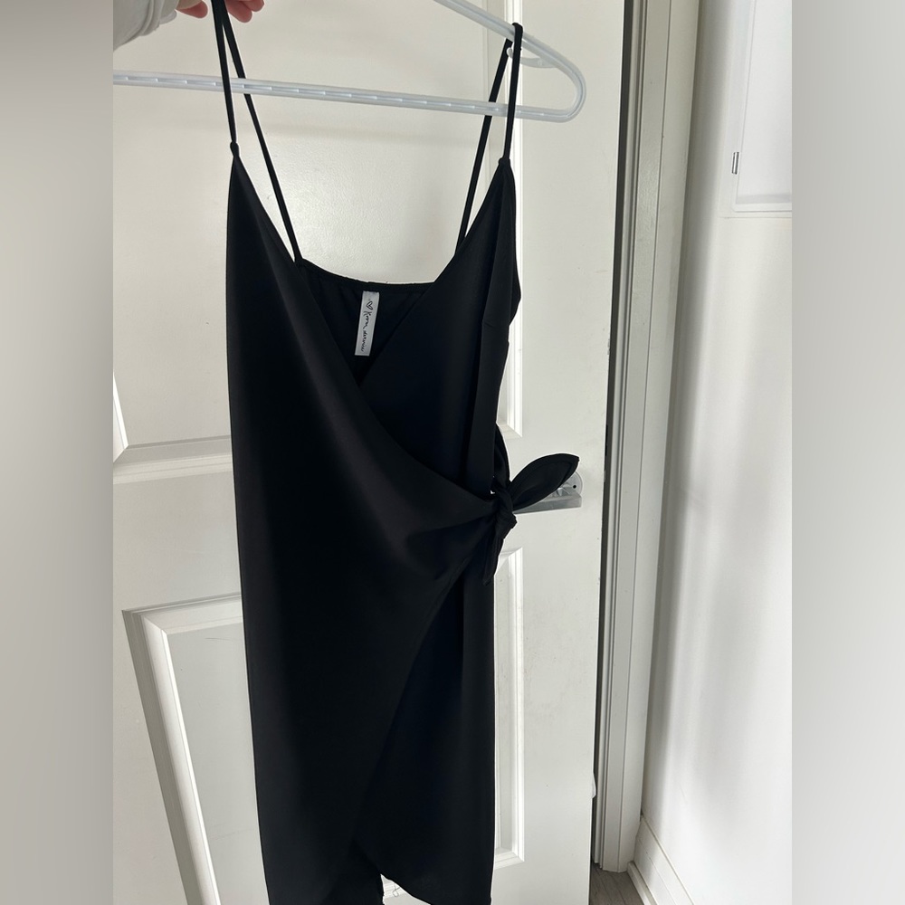 M by MENDICINO
Black dress with cross over front tie and slit
Thin straps